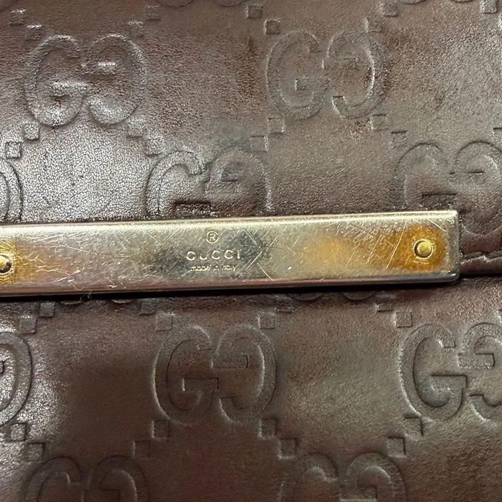 Gucci Dark Brown Embossed Clutch wallet inside is clean. GUC much life left!